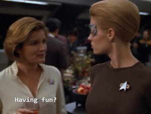 Kathryn Janeway and Seven of Nine from Star Trek: Voyager standing together. Janeway says, "having fun?"